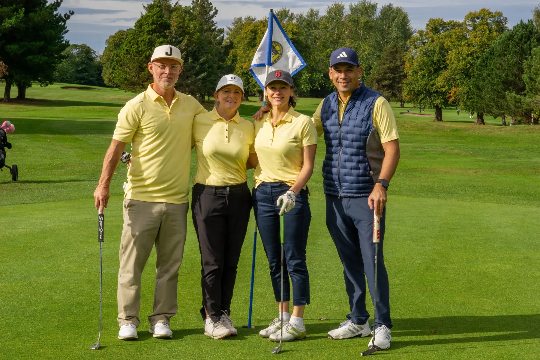 charity golf day - four golfers on a golf course